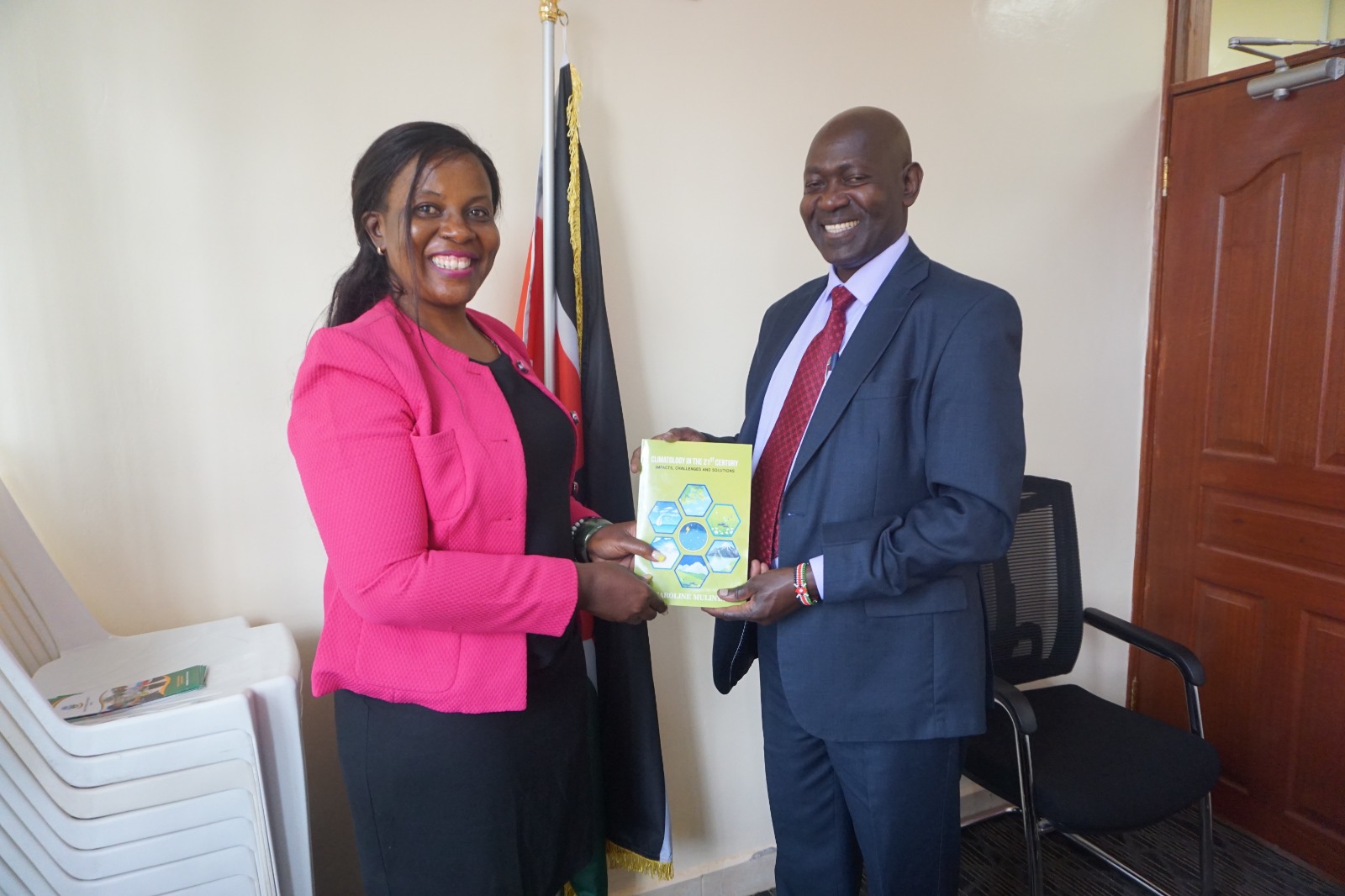 Dr Mulinya Presenting her book to KAFU Ag.VC Prof. Peter Mwita