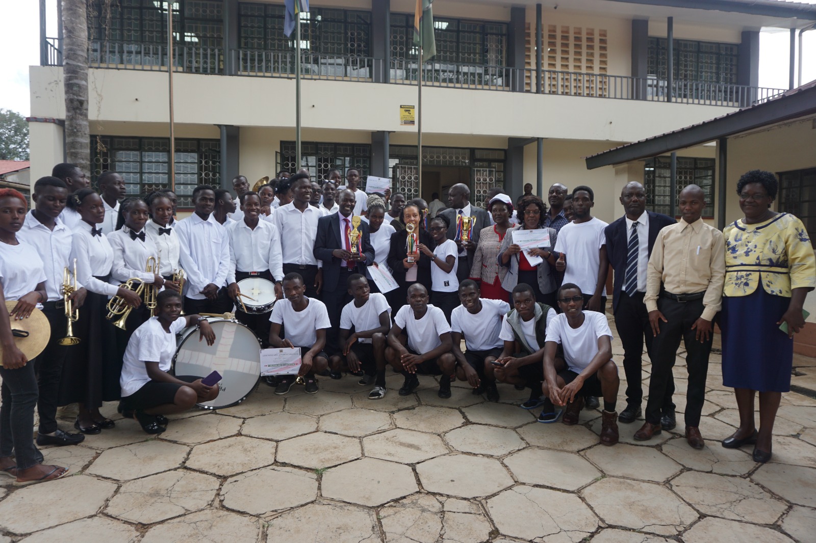 KAFU Council ChairDr Bernadette Mungai and Management in a group photo with the band