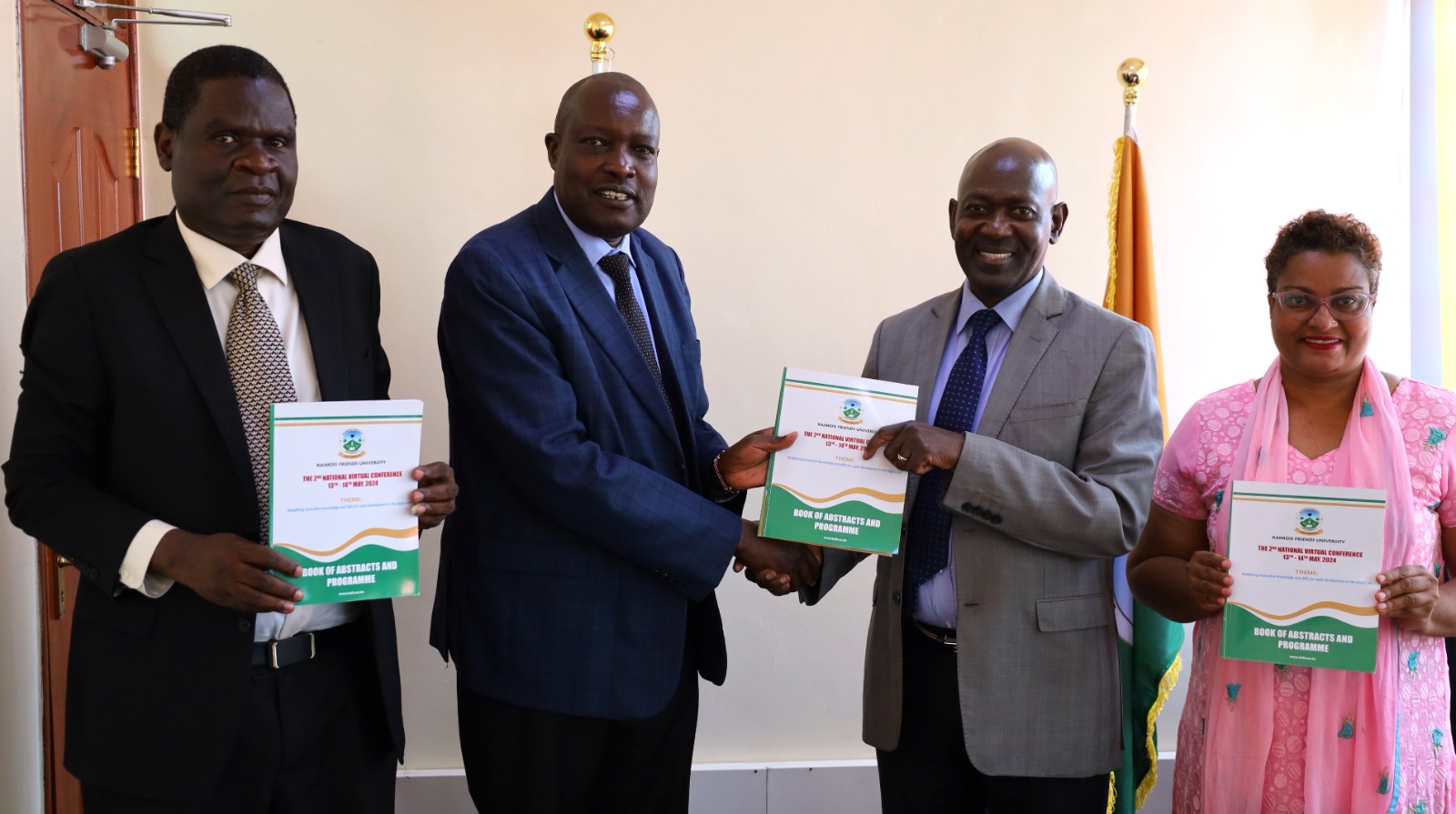 The KAFU Acting Vice Chancellor receiving 2nd KAFU National Virtual conference booklet